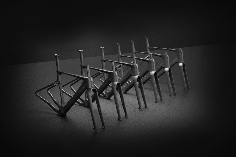 Six framesets lined up in low light, one per colorway
