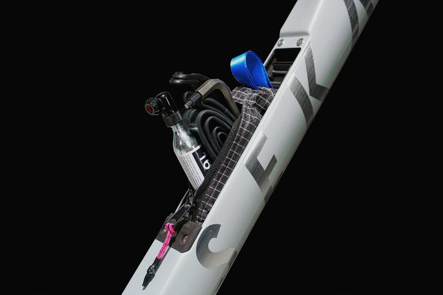 Down tube storage packed with tube, tool and CO2