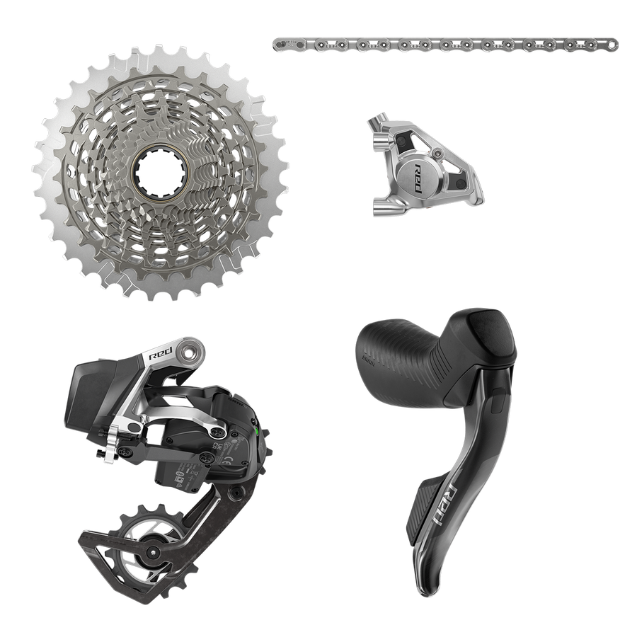 Road groupset laid out flat on white: cassette, chain, disc brake caliper, rear derailleur and a shift-brake lever