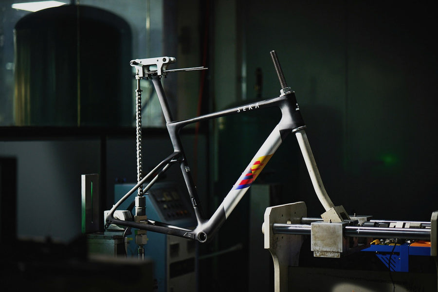 Frameset clamped in a fatigue test rig in the workshop