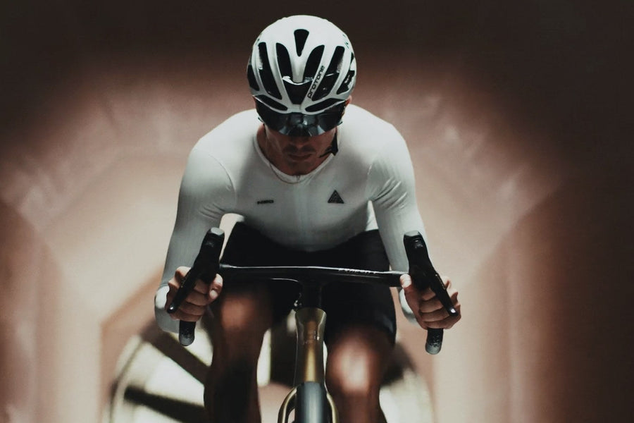 Rider front-on at speed, tunnel walls blurred behind